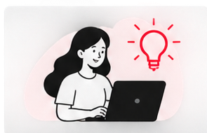 Person using a laptop beside a light bulb